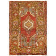 Antique Turkish Oushak Carpet with Stylized Motifs in Red, Green 
Yellow Tones