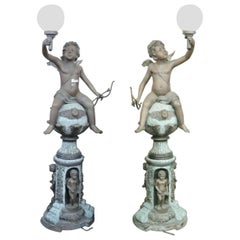 Companion Pair of Bronze Cherub Light Posts