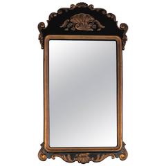 Rococo Revival Style Mirror with Black and Gilded Carved Wood Frame