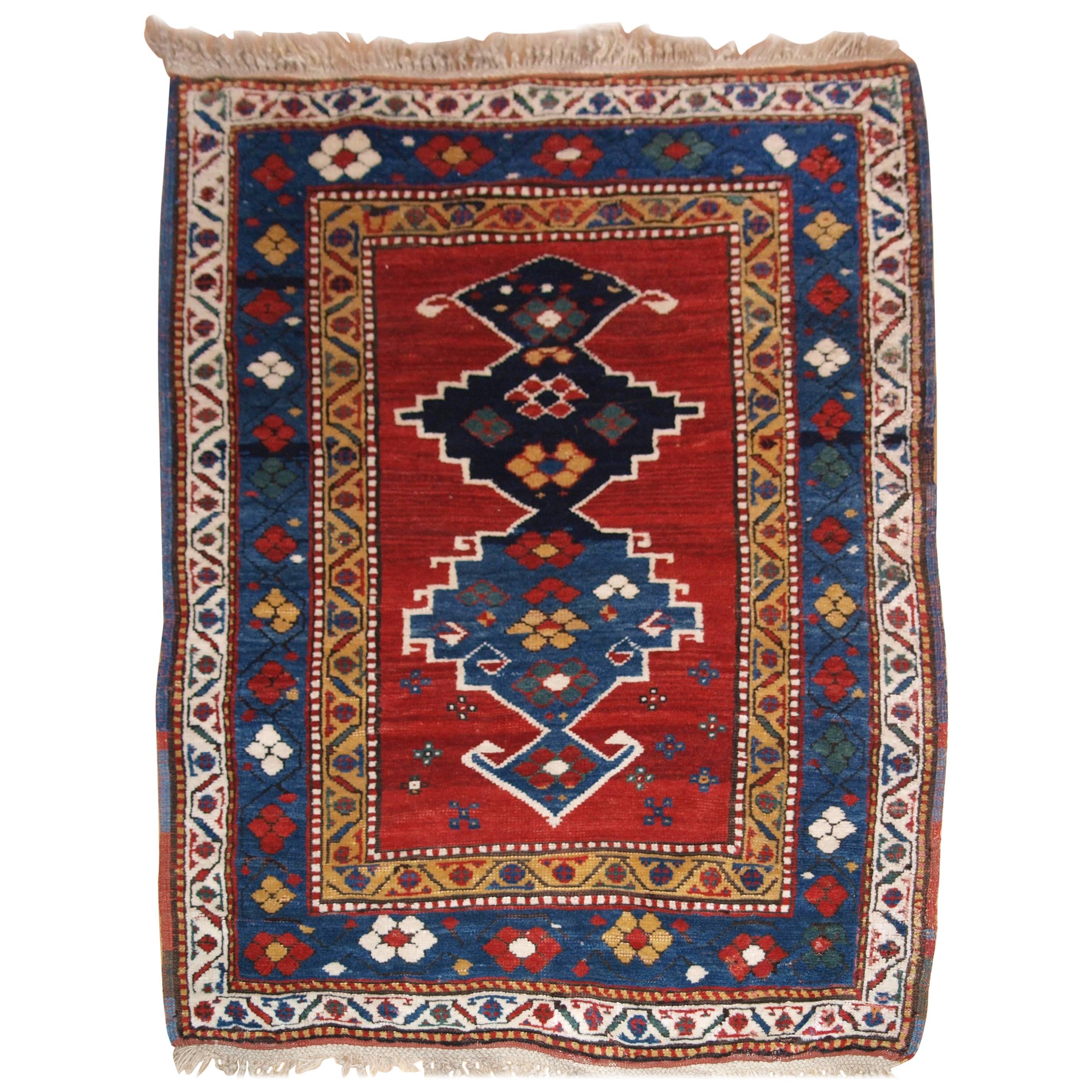 Antique Caucasian Kazak Rug with Linked Medallion Design For Sale