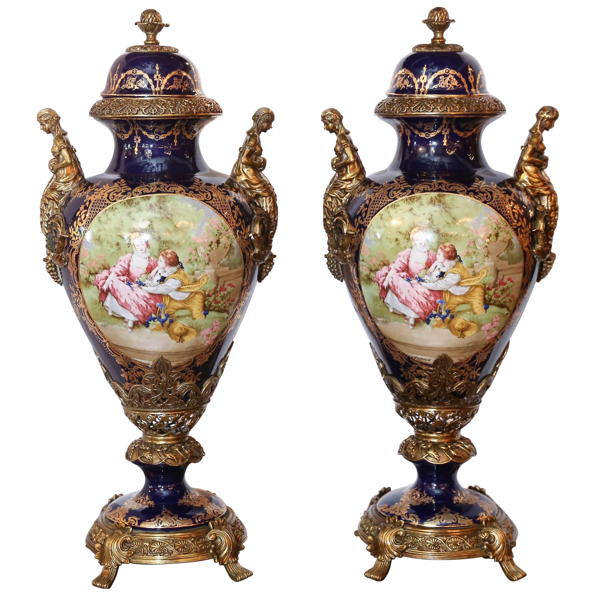 Pair of Large Porcelain Lidded Urns, Bronze Mounted and Gilt Decorated