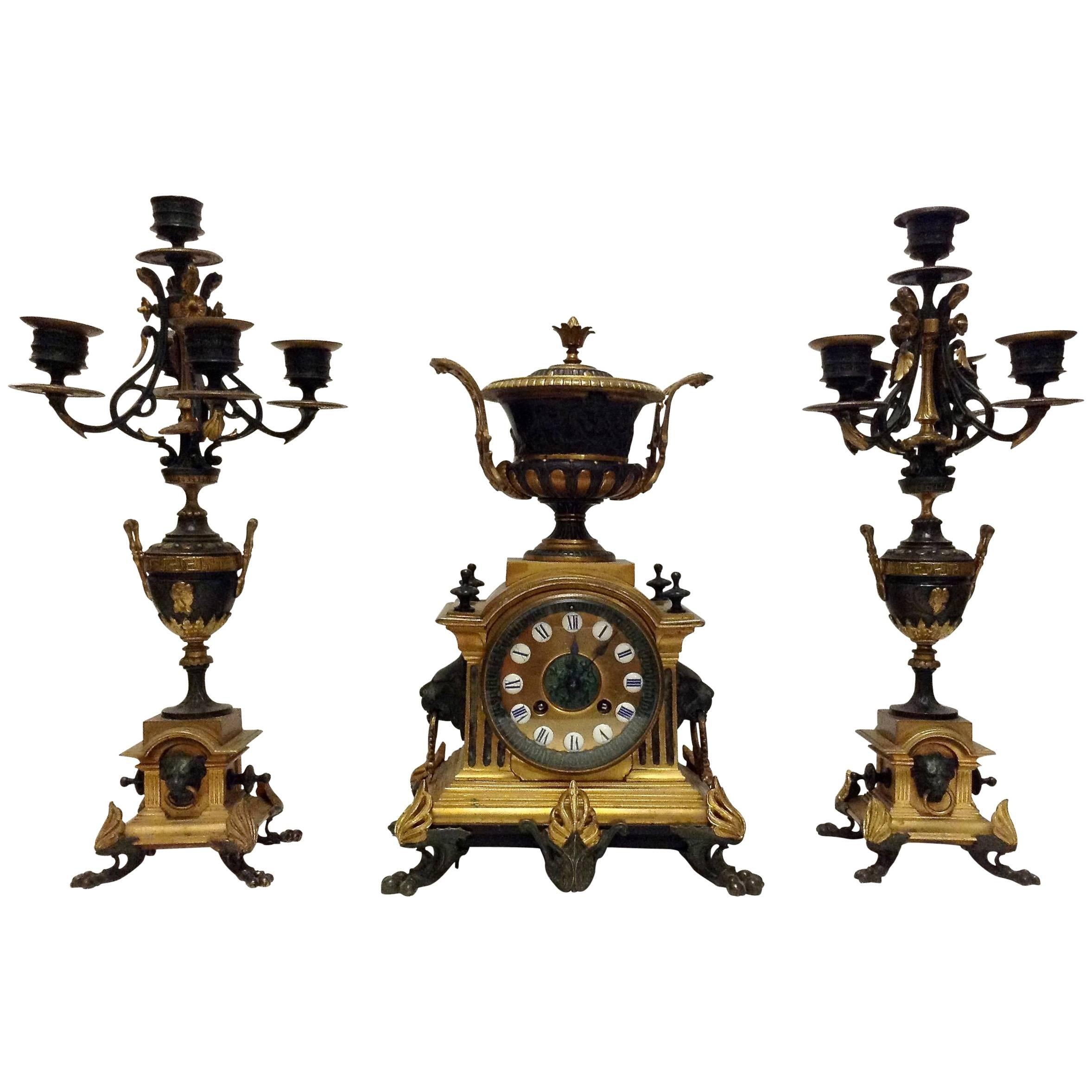 French Bronze Clock Garniture with Urn and Lion Motif by Japy Freres For Sale