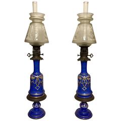 Pair of Blue Gilt and Enamelled Bohemian Glass Oil Lamps with Matching Stands