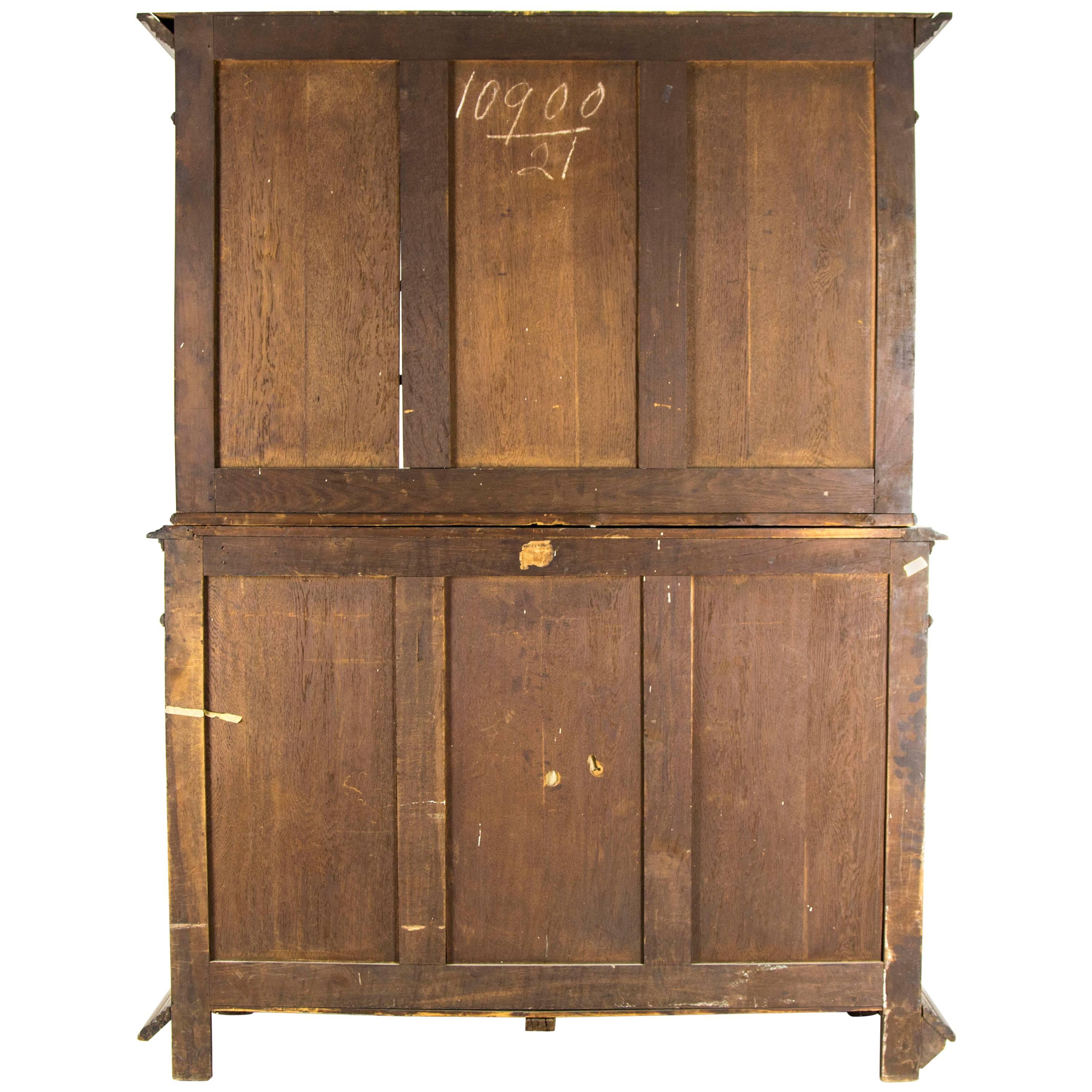 France
1880
Solid walnut construction
Original finish
Carved top, two glass doors below (no shelves)
Two carved dovetailed drawers with original hardware
Two panelled cupboard doors below with single wooden shelf interior
Ending on short bun