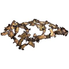 Brutalist Wall Sculpture of Patinated Brass in the Manner of Silas Seandel