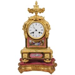 Pendule en bronze doré et porcelaine de Sèvres par Raingo Frères, en parfait état de marche