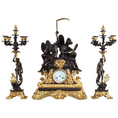 Exceptional Napoleon III Clock "The Use of Time” and Pair of Candlesticks