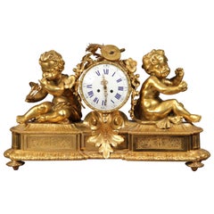 Très belle horloge de cheminée en bronze doré de la fin du XIXe siècle