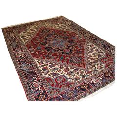 Antique Persian Heriz Carpet with a Traditional Medallion Design