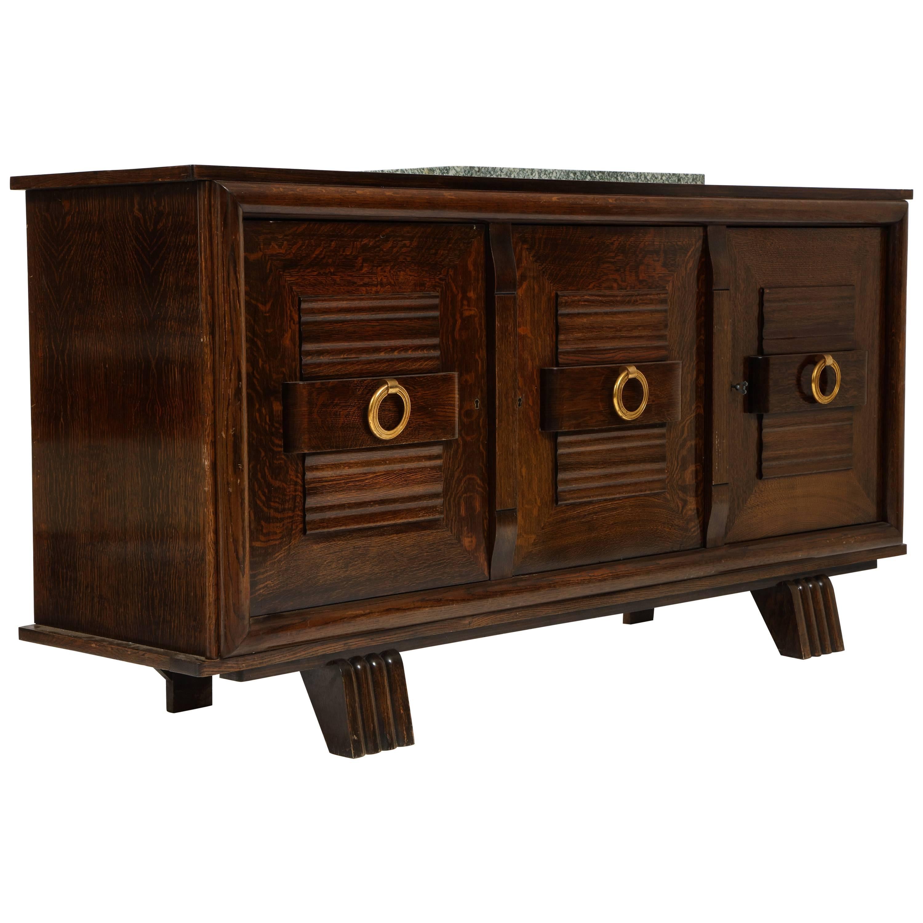 French Deco oak sideboard credenza brass pulls, Mid-Century, 1940s-1950s

This a beautiful and handsome oak sideboard with brass pulls and original keys.
Original Green marble on top. This item is in very good original condition with beautiful
