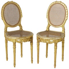 Pair of 19th Century, Louis XVI Hand-Carved Giltwood Side Chairs with Caning