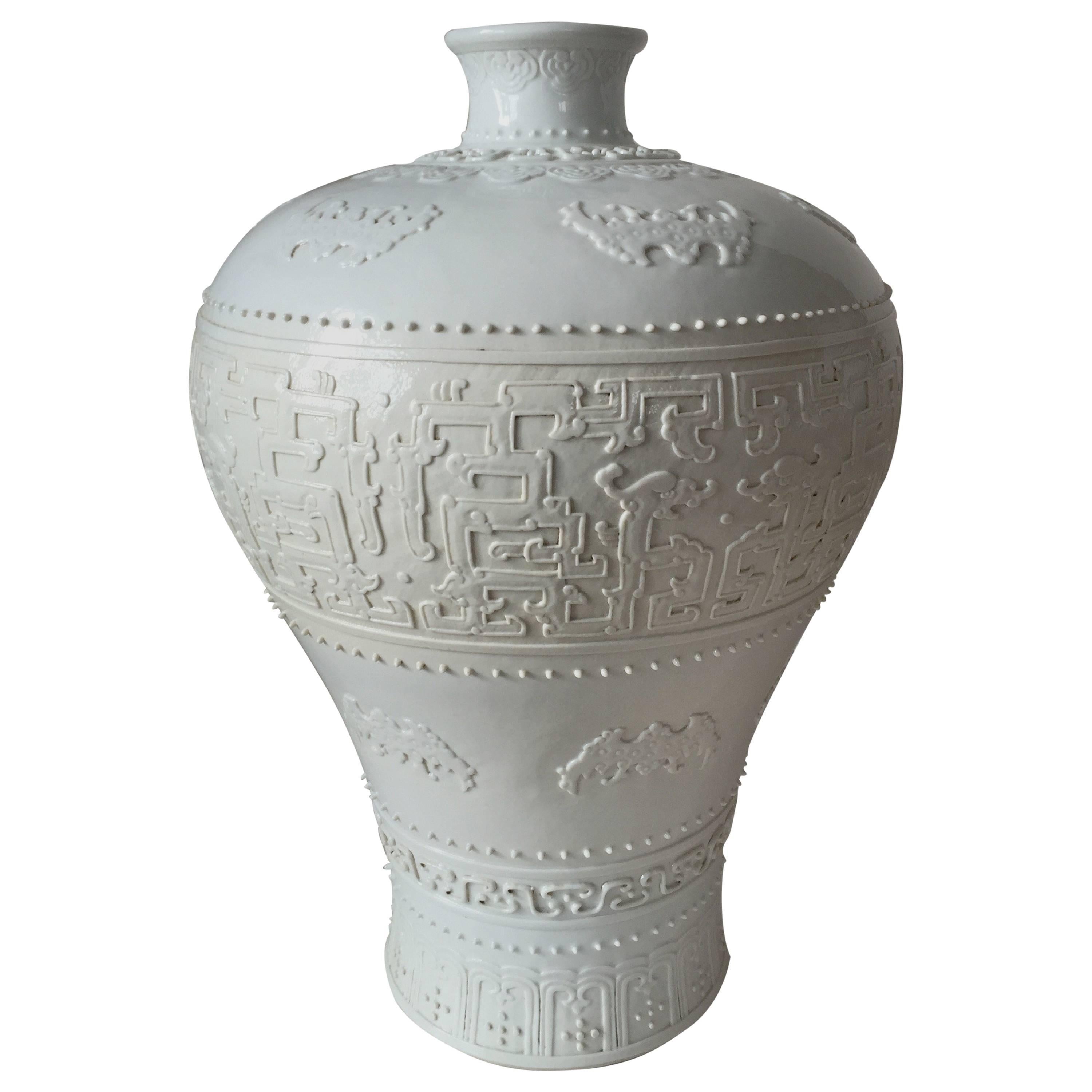 20th Century Chinese Chilong Relief Blanc de Chine Meiping Vase Qianlong Mark For Sale