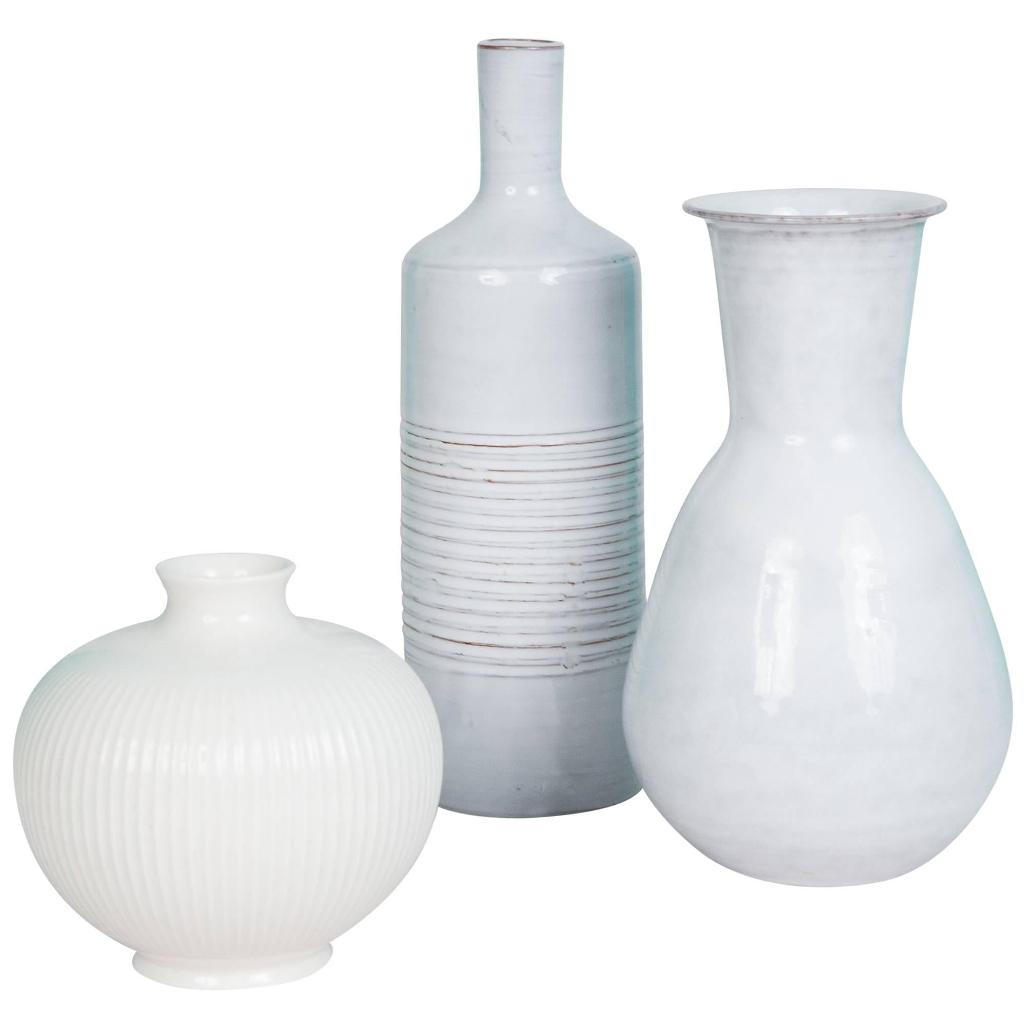 Set of Three White/Off-White Continental Ceramic Vases For Sale