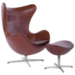 Pair of Arne Jacobsen for Fritz Hansen Egg Chairs and Footstools, Denmark, 1965 11