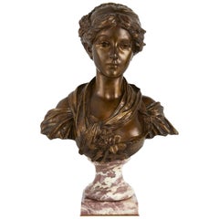 Busto antiguo de bronce patinado de una joven dama, según Greuze