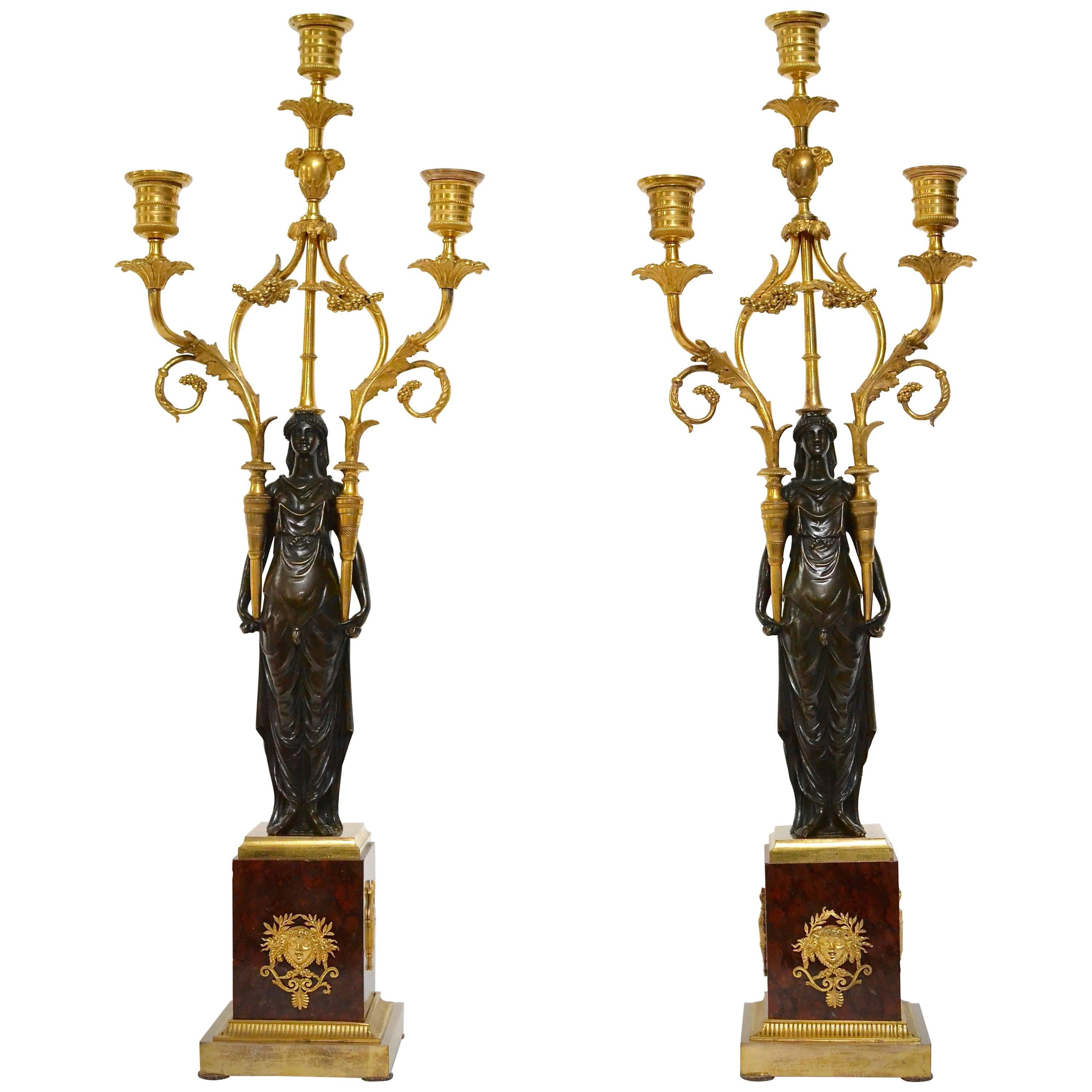 Pair of Louis XVI Gilt Bronze and Patinated Candelabra on Red Marble Bases