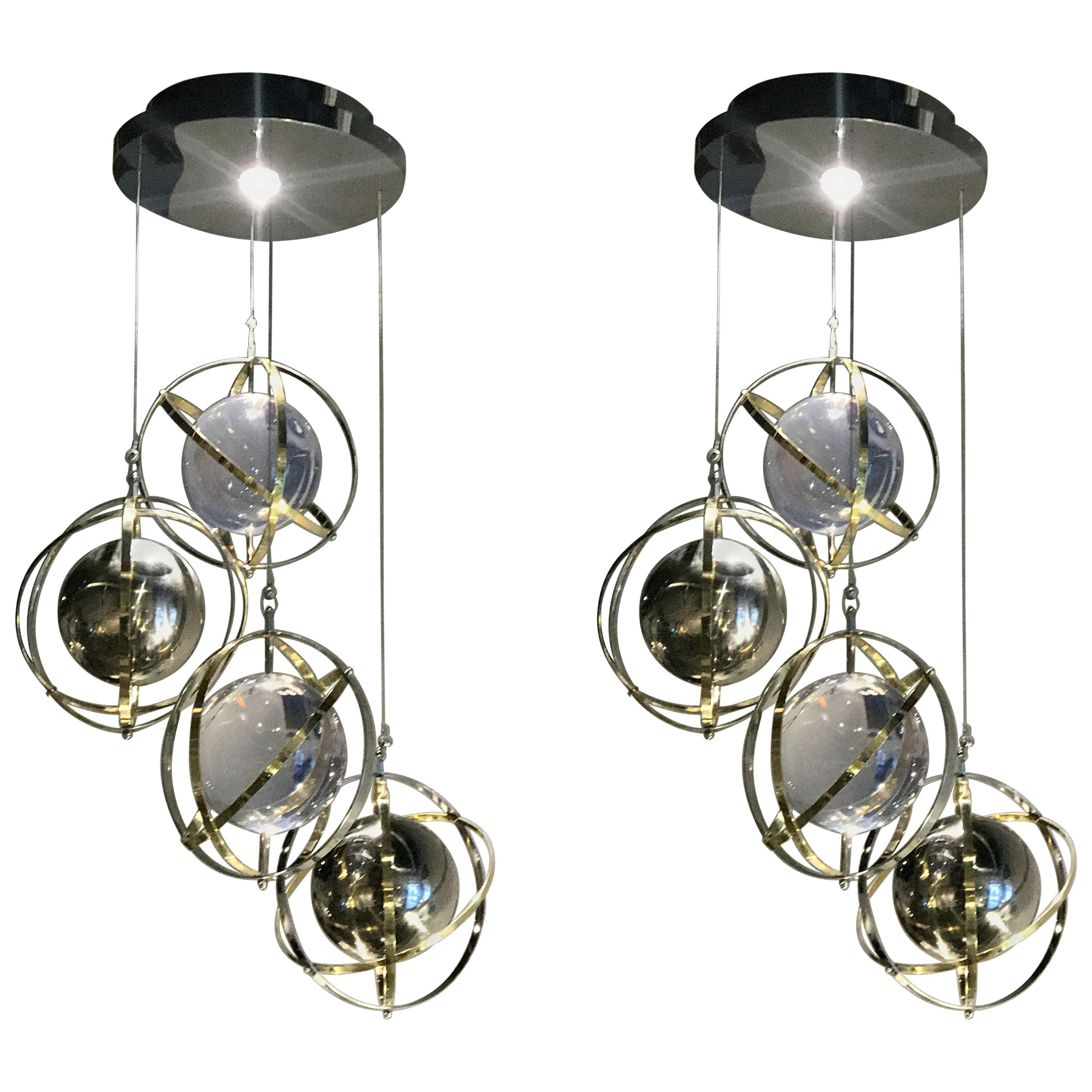 Pair of Brass, Stainless Steel and Lucite Armillary Sphere Chandeliers