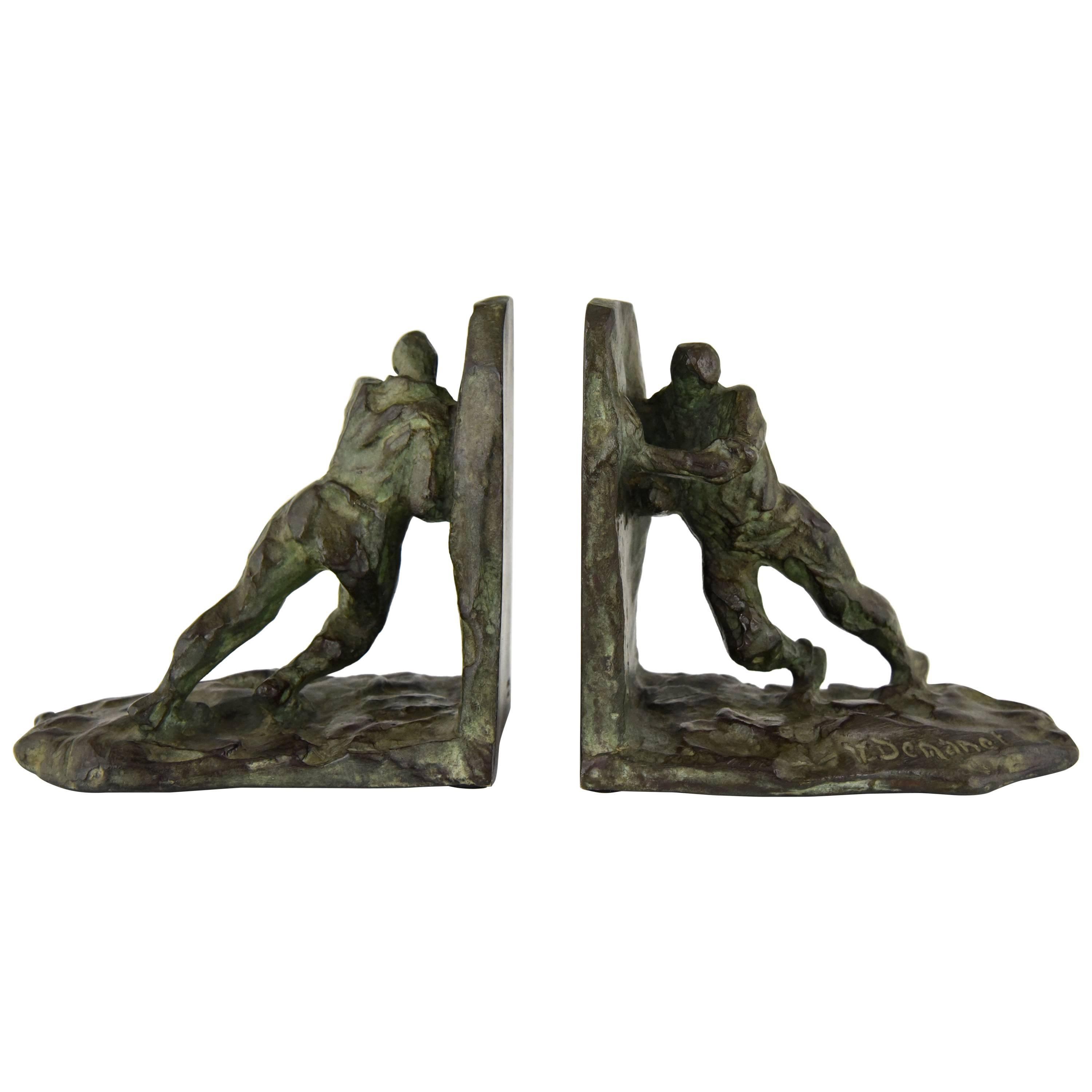 Art Deco bronze bookends pushing men Victor Demanet, 1930