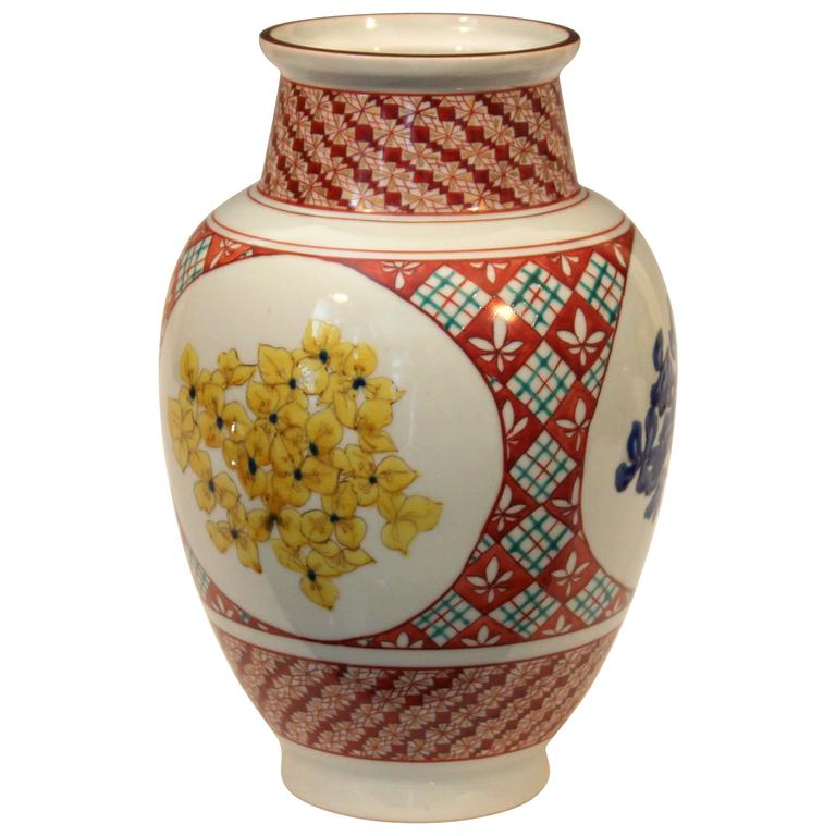 Kutani vase with vibrant flower motif and signed