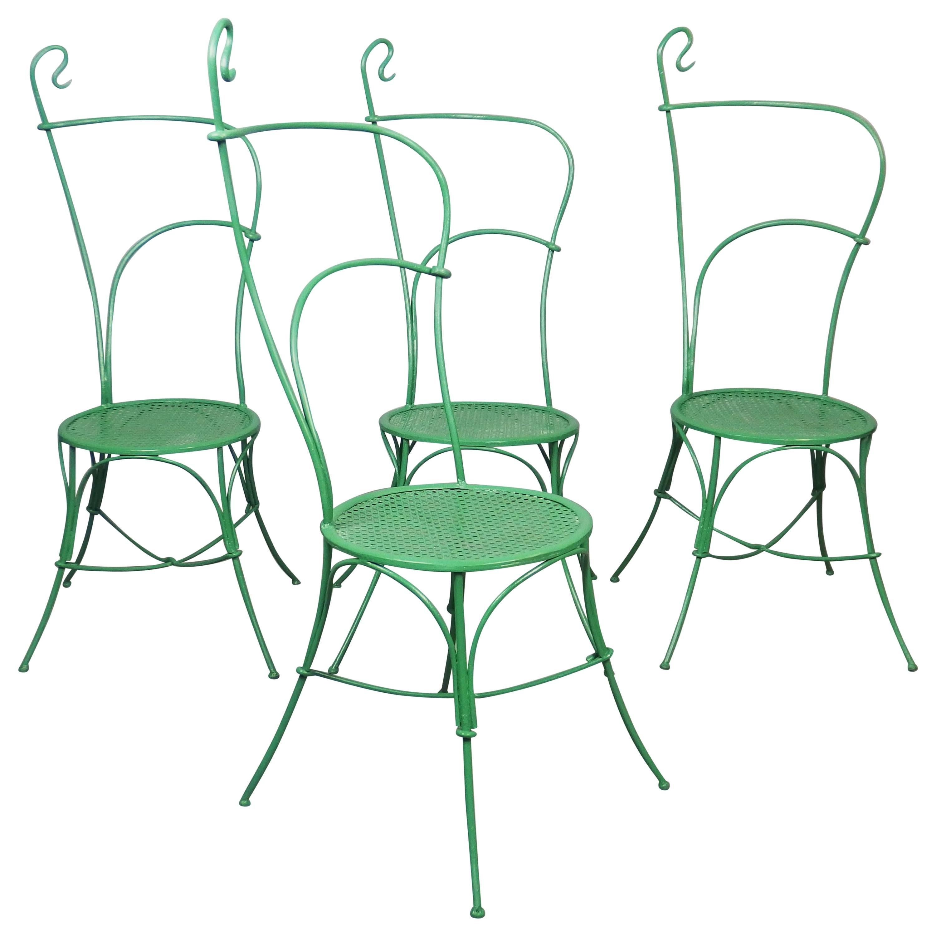 Rare set of four Art Nouveau garden chairs with a sybilline and voluptuous line reminding Horta architectural refinement.
The iron structure is green painted as it was originally and the metal seat is changed.