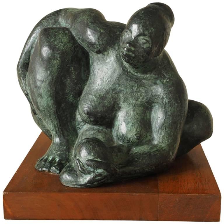Sculpture en bronze d'une mère et d'un enfant d'Olger Villegas