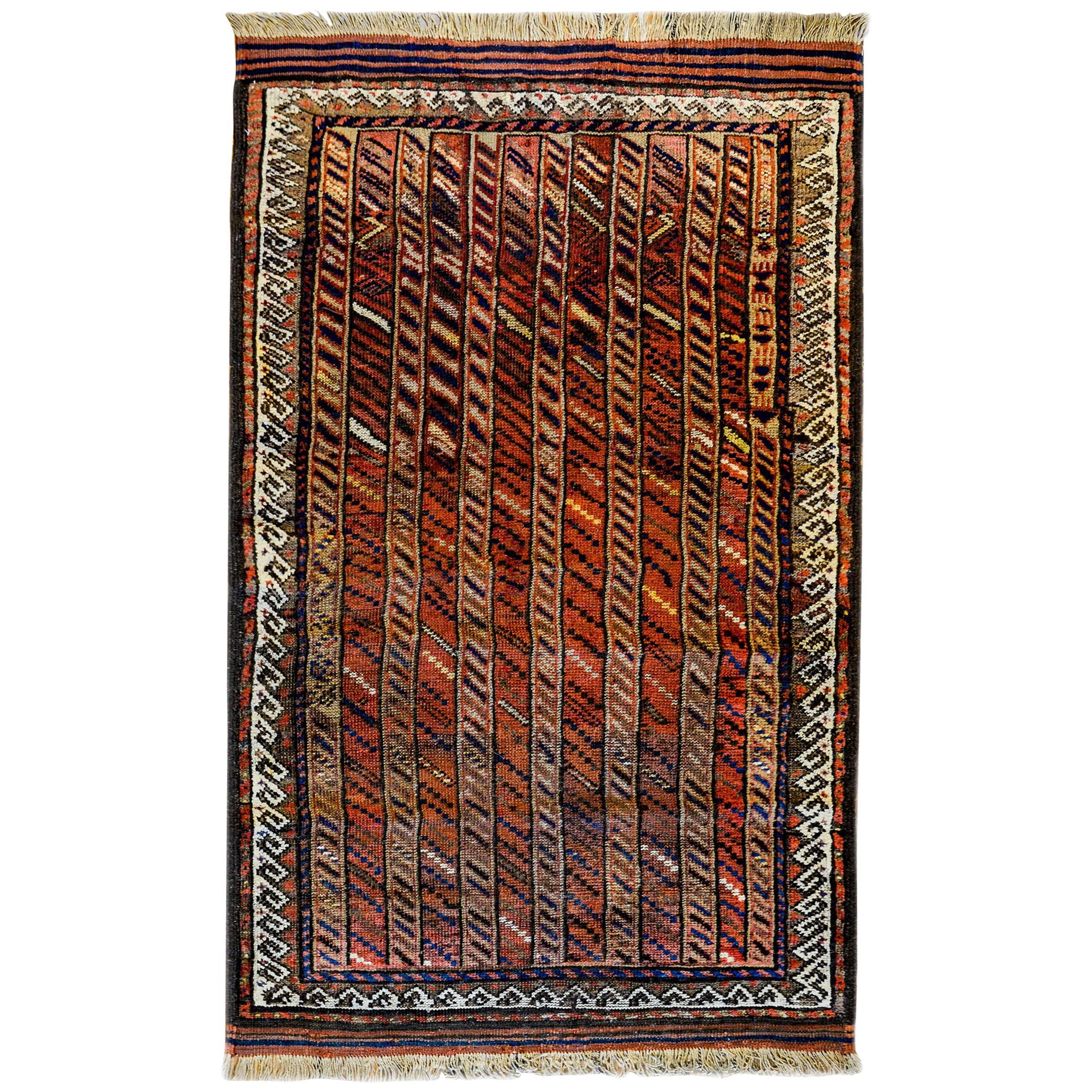 Superbe tapis de baluchon des années 1900