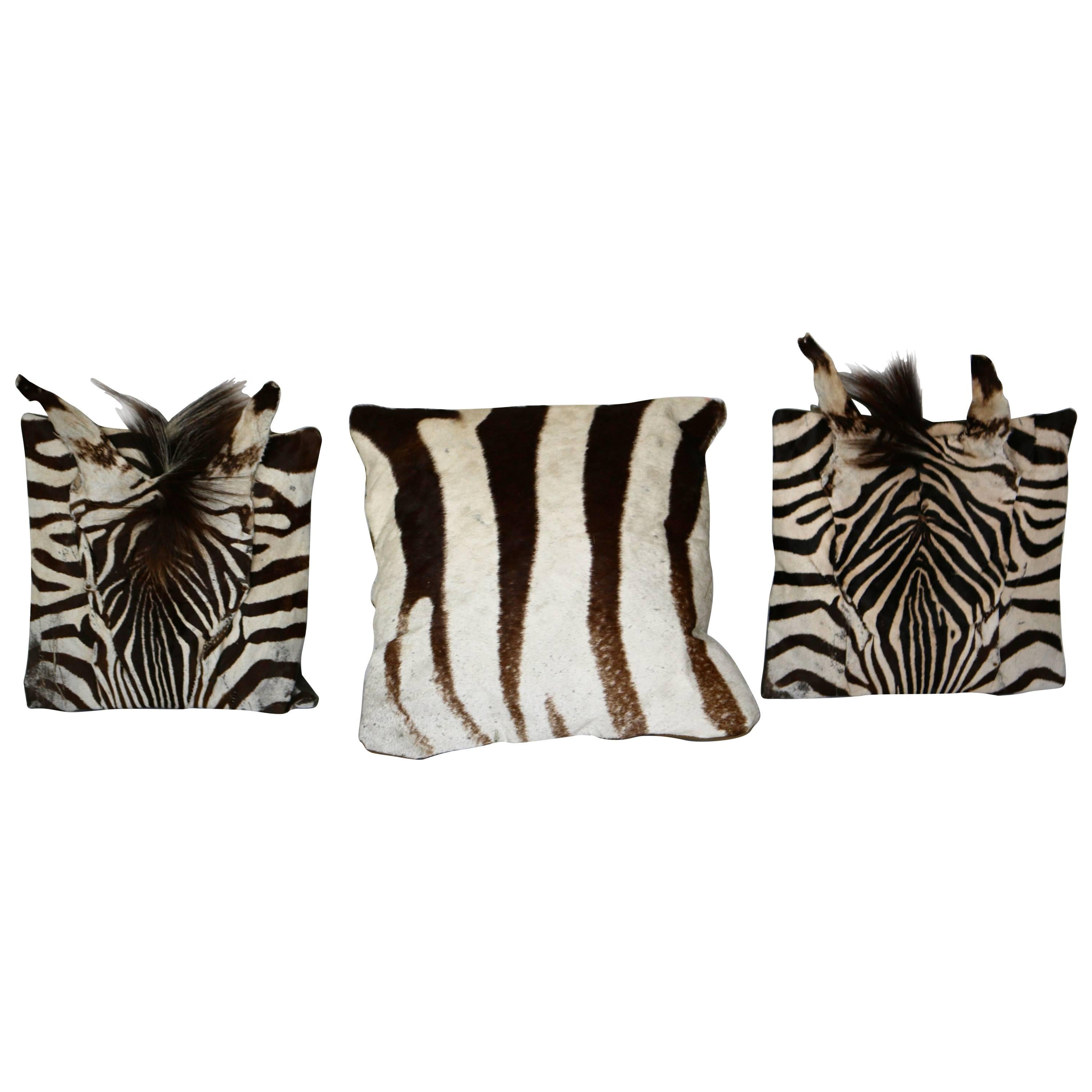 Set of three authentic zebra skin pillows.
The two-side pillows where made with authentic zebra head and authentic zebra hair. The main pillow was made in authentic zebra skin. This set of pillows would be great for a sold colored sofa or any zebra