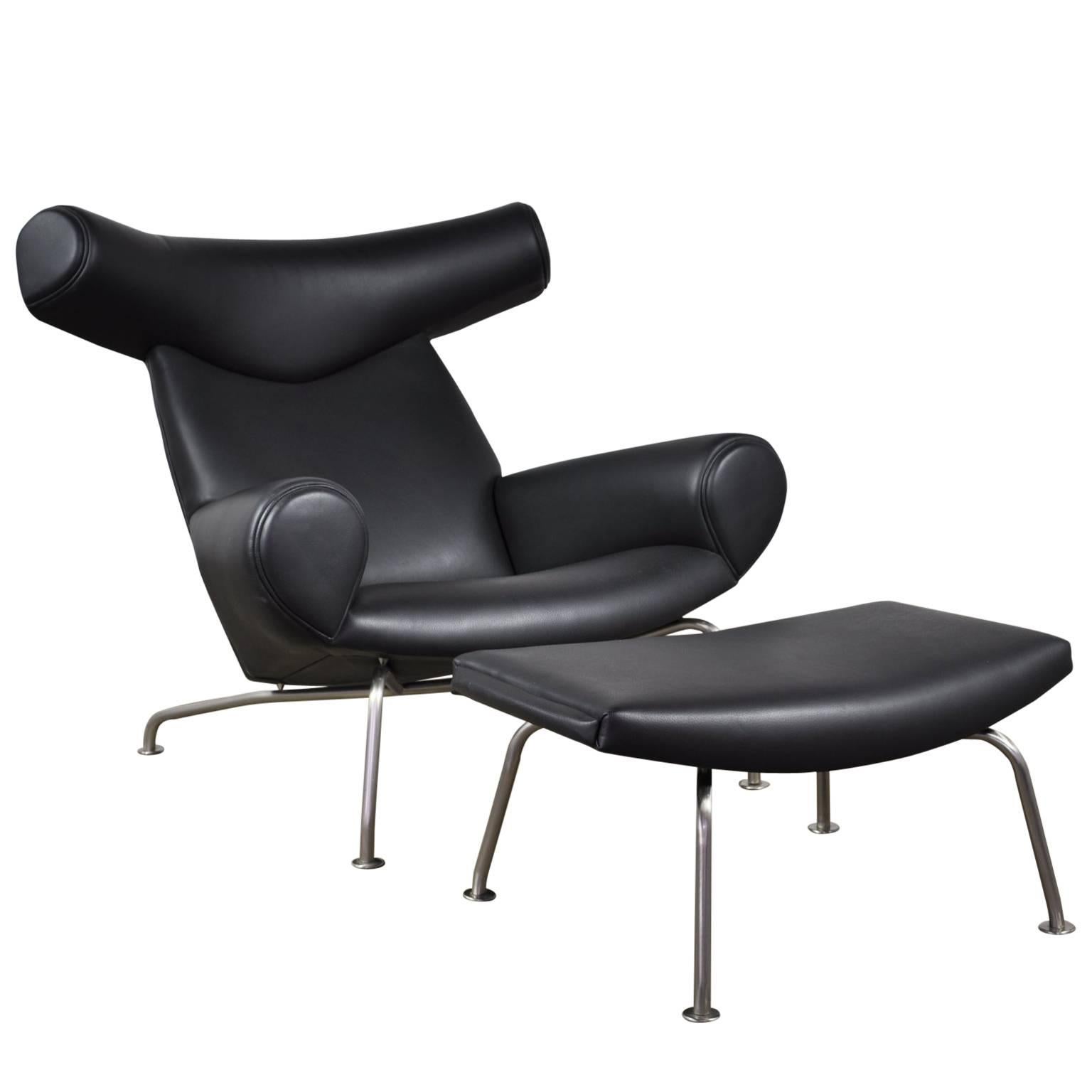 Vintage Black Leather Hans Wegner Ox Chair and Ottoman for A.P Stolen For Sale