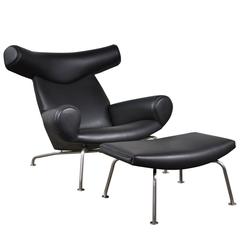 Vintage Black Leather Hans Wegner Ox Chair and Ottoman for A.P Stolen