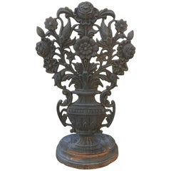 English Iron Garden Ornament with over-sized floral motif projecting from urn
