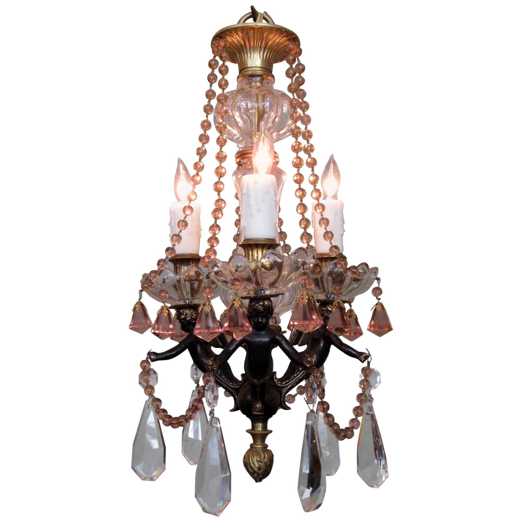 Small Early 20th Century French Empire Bronze and Peach Crystal Chandelier