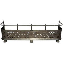 English Brass Chased Rope and Dragon Motif Fireplace Fender, Circa 1770