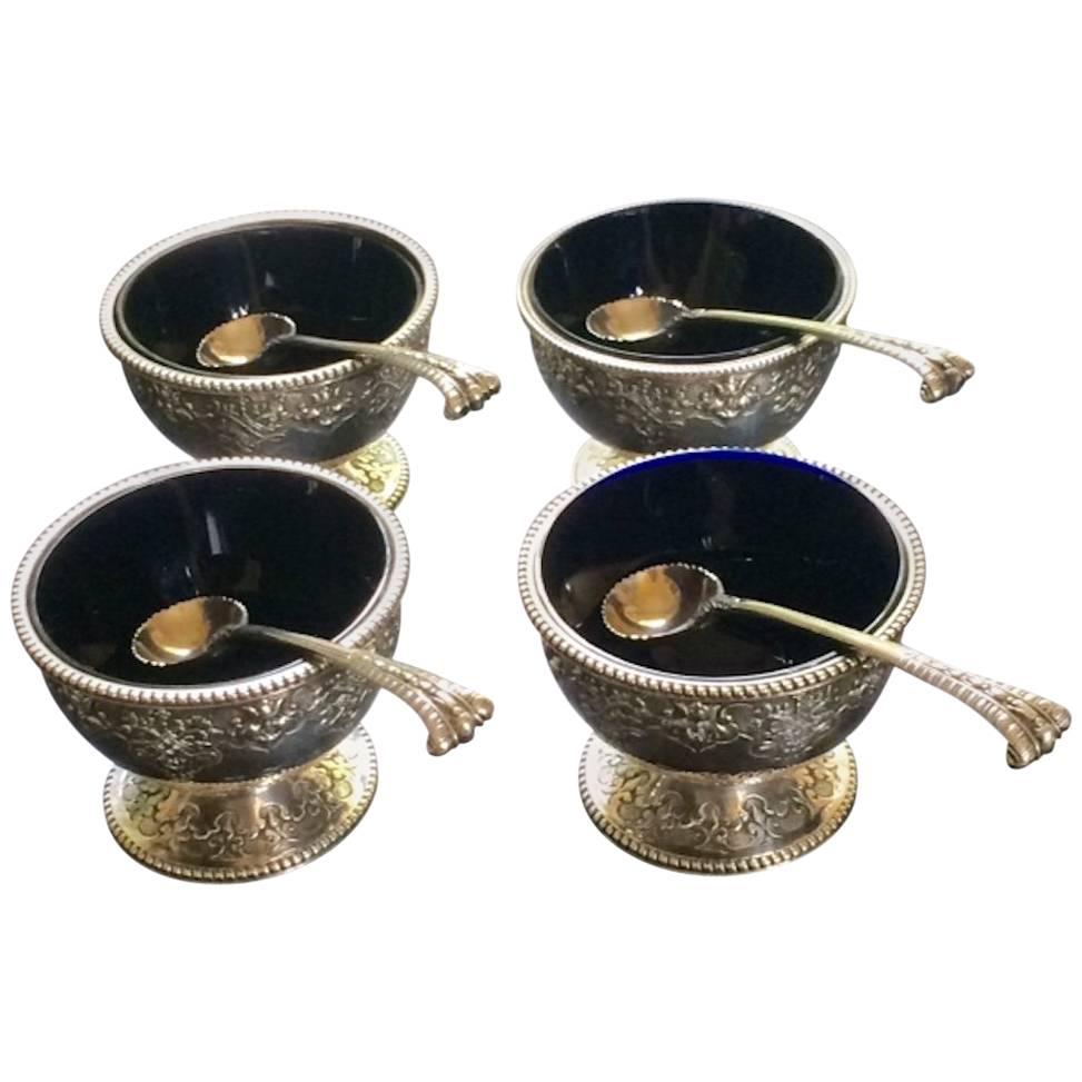 Set of Four Silver Salts Complete with Their Original Spoons by Robert Hennell