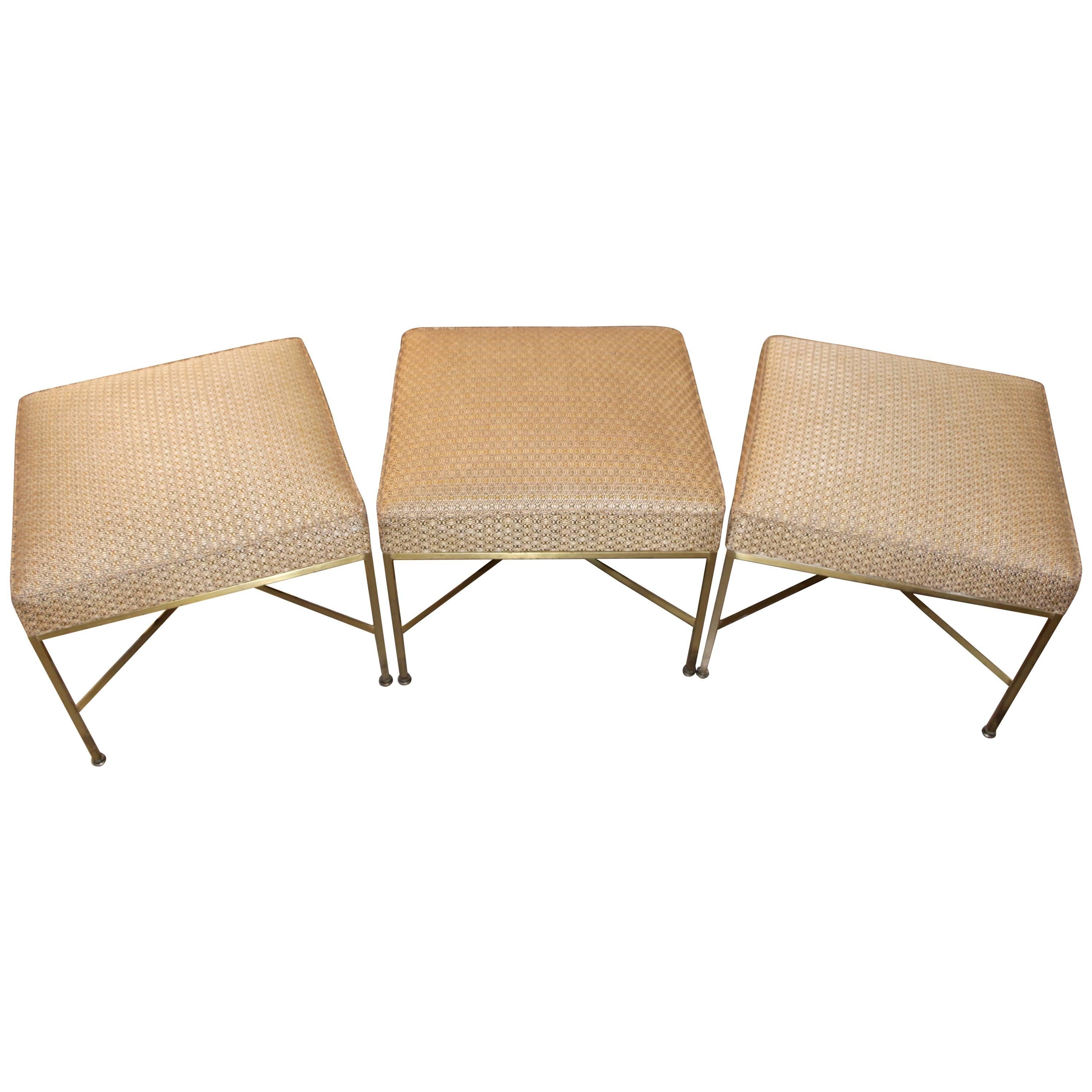 Paul McCobb for Directional Set of Three Brass Ottomans with Original Fabric