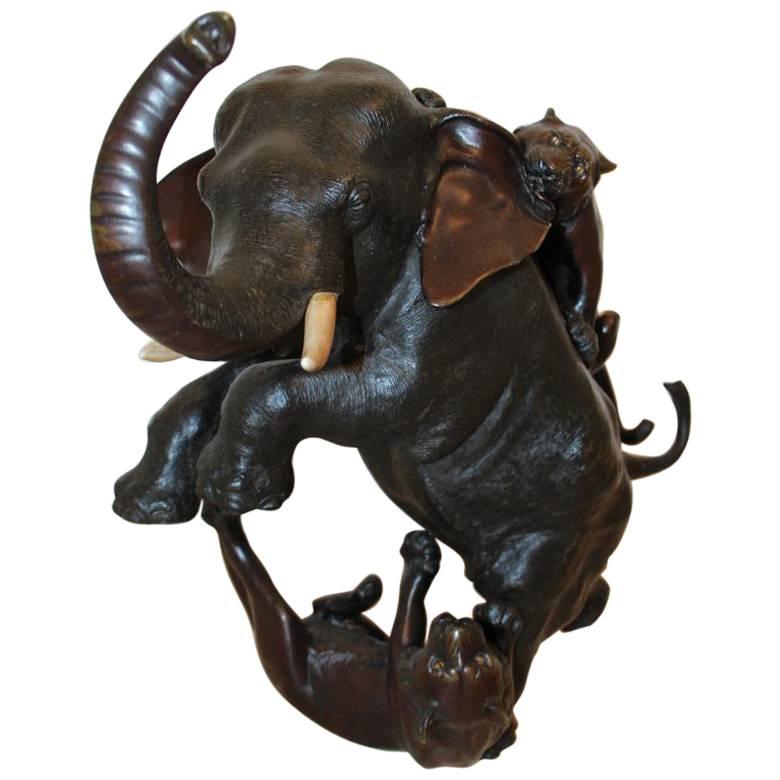 Late 19th Century Japenese Bronze Elephant Fighting Tigers For Sale