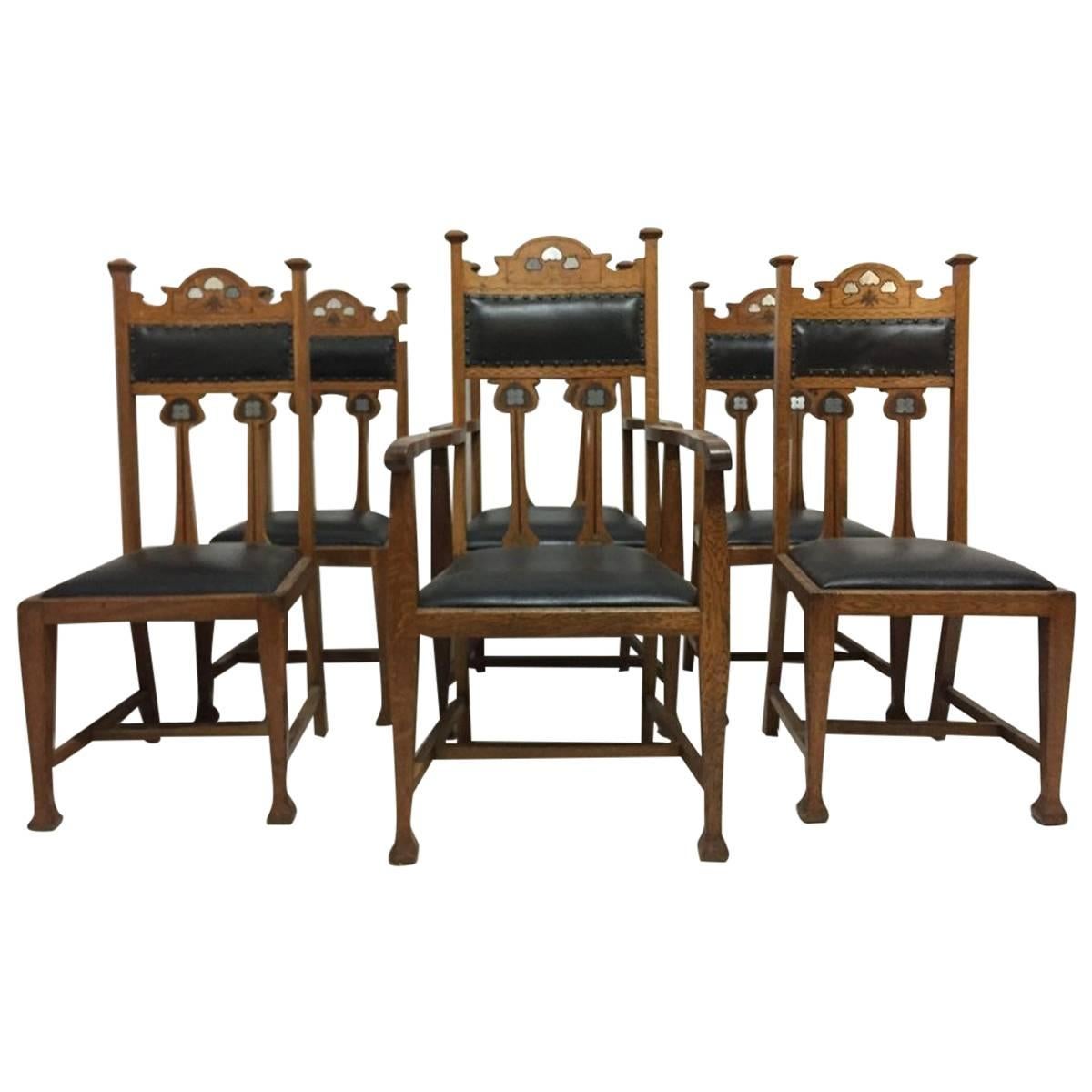 Set aus sechs Arts and Crafts-Stühlen mit stilisierten Blumenintarsien aus Zinn-Ebenholz