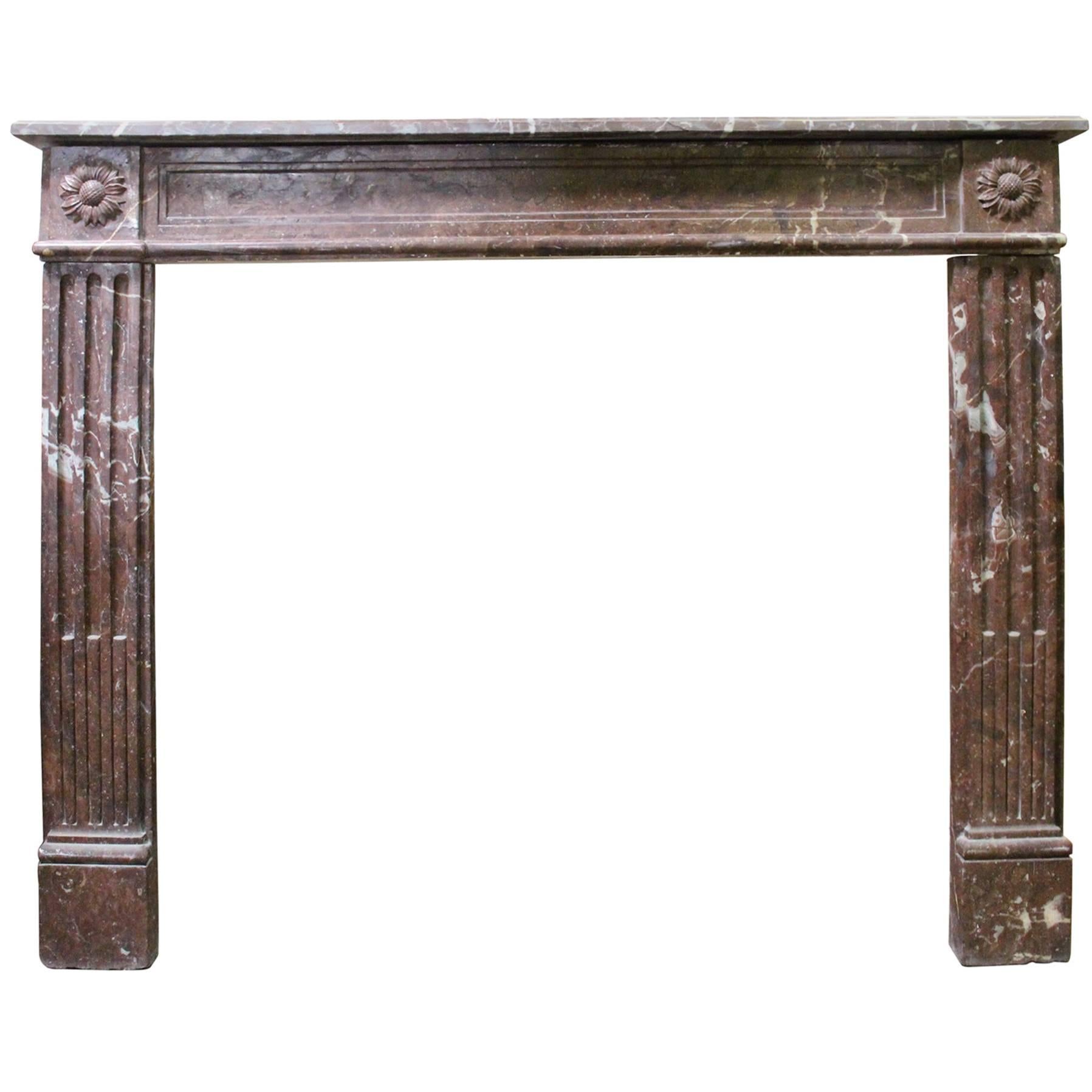 French Louis XVI Style Marble Mantel with a Sunflower Motif