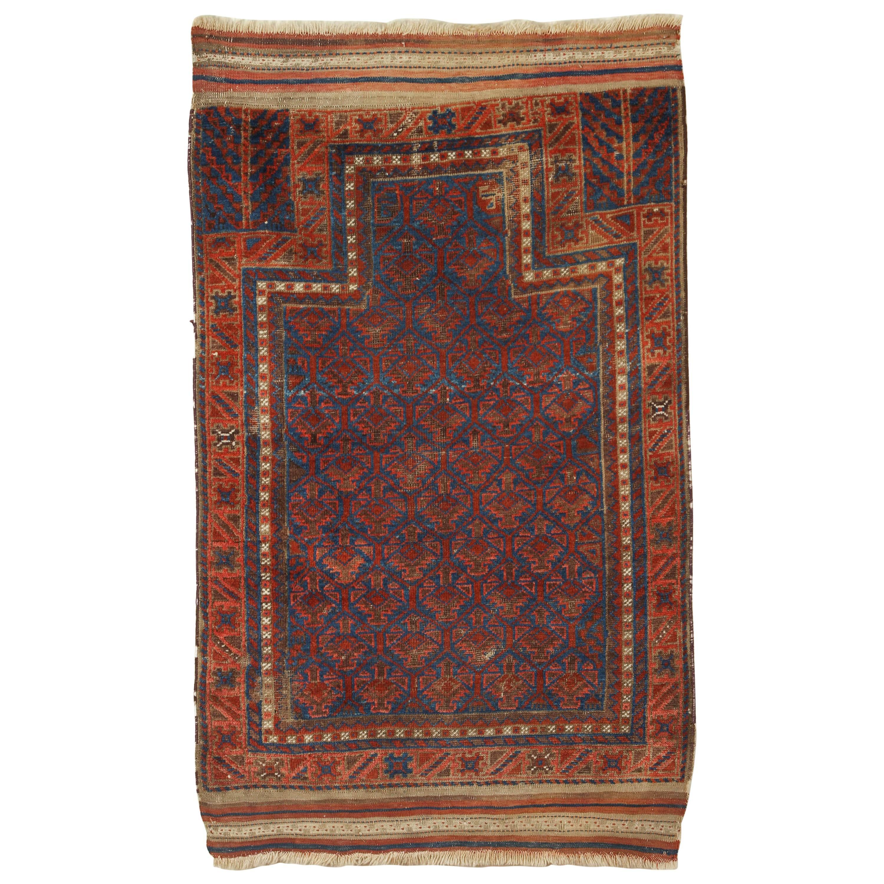Antique Baluchi Blue Field Rug with Orange and Ivory For Sale