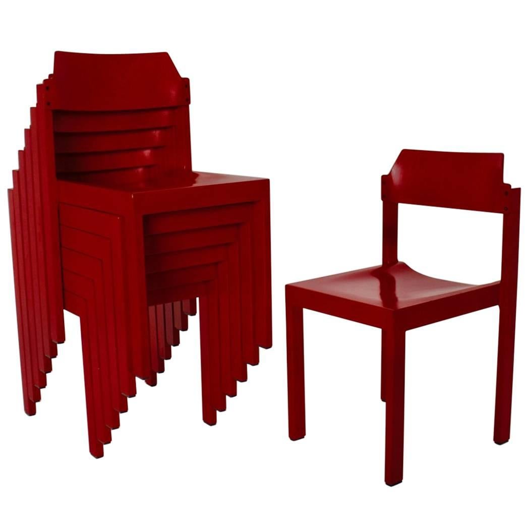 Mid Century Modern vintage Set of seven cherry red lacquered vintage Dining Room Chairs by Rainer Schell 1962 - 1964 Germany from red lacquered beechwood. Also the set of beech dining room chairs features a moulded plywood seat. So the seating