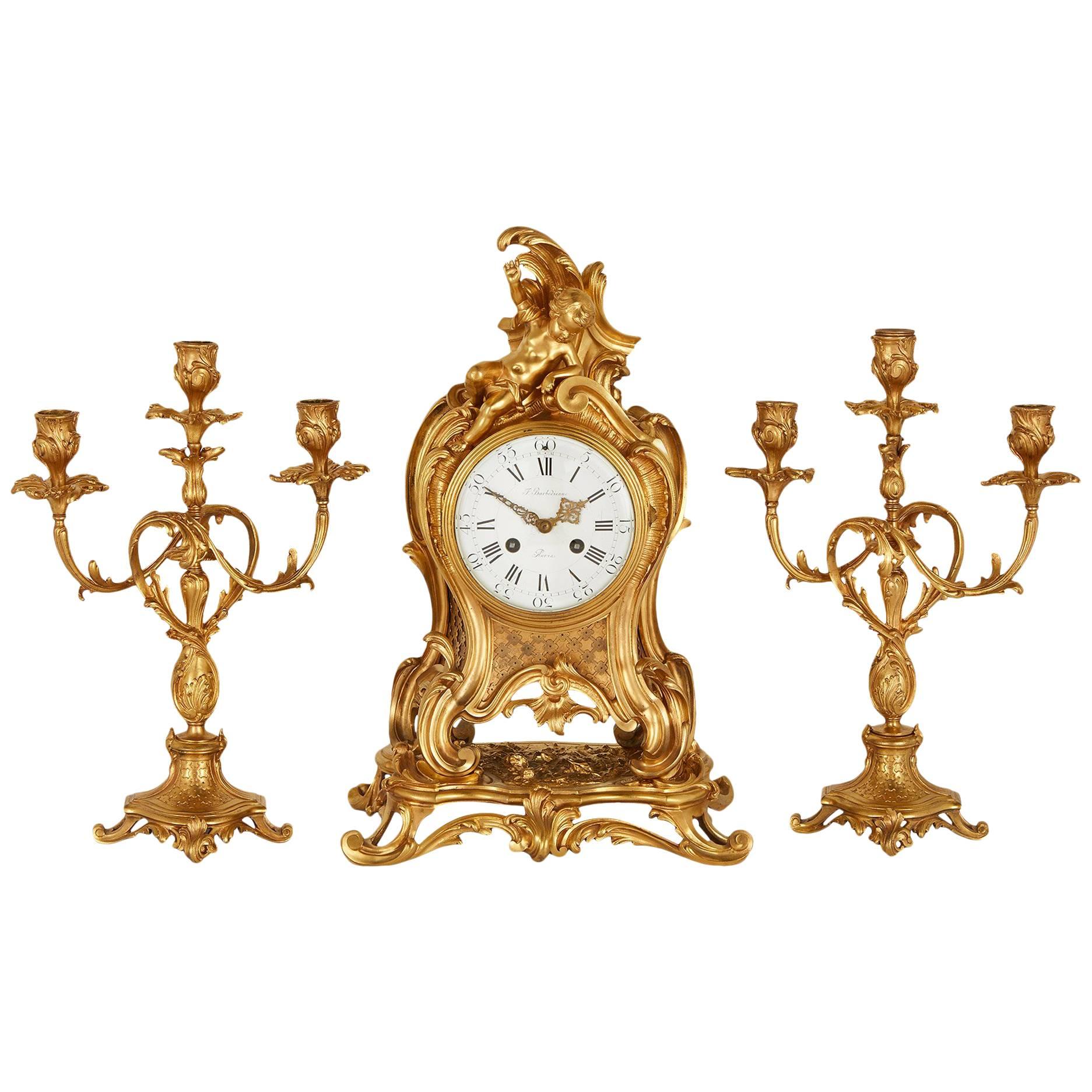 Ensemble d'horloges trois pièces en bronze doré de style Louis XVI par Barbedienne en vente