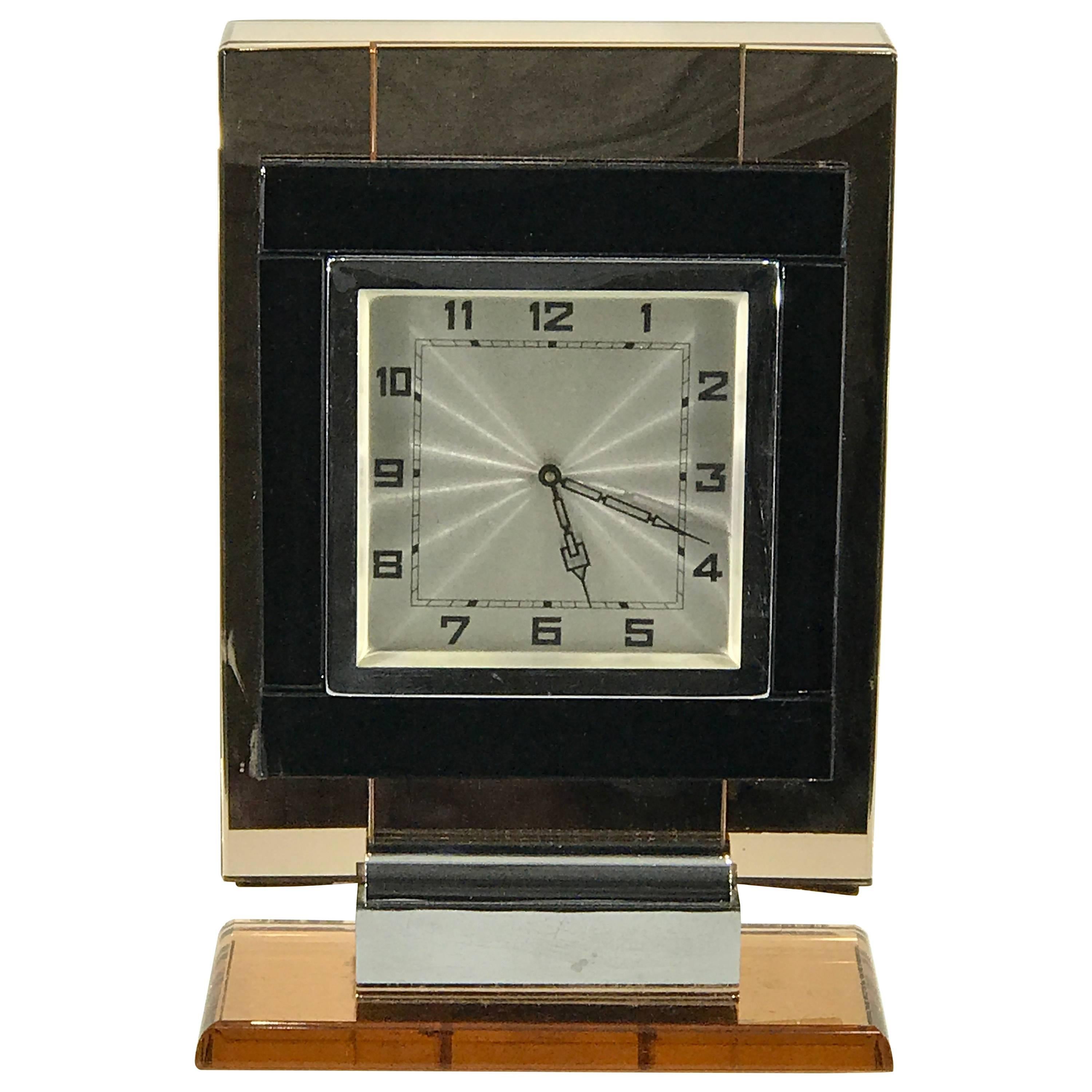 French Art Deco Chrome and "Coral" Mirrored Table Clock For Sale