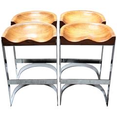 Four Vintage Oak and Chrome Saddle Barstools by Warren Bacon