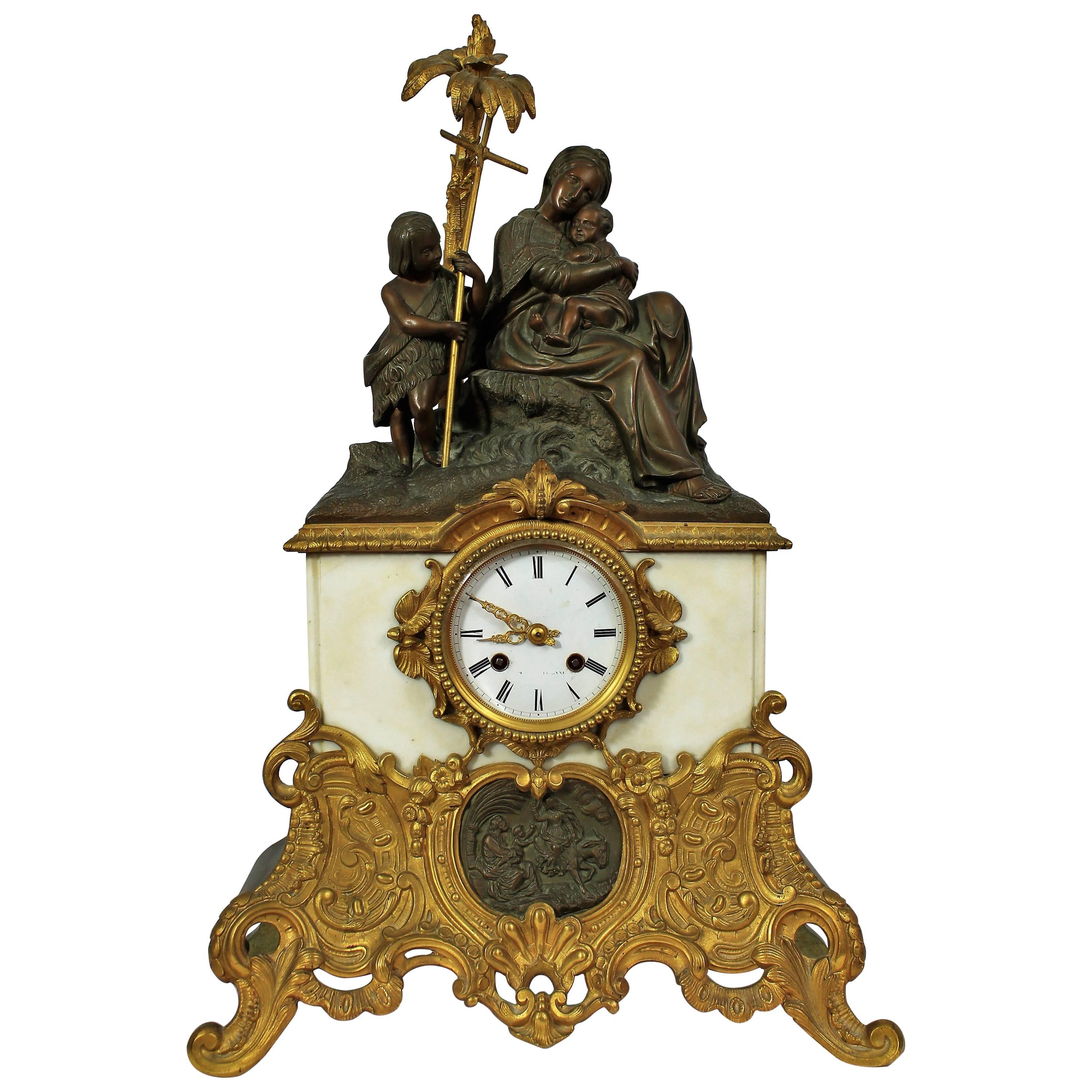 Horloge pendule en bronze et marbre représentant un enfant Vierge et Saint Jean Baptiste en vente