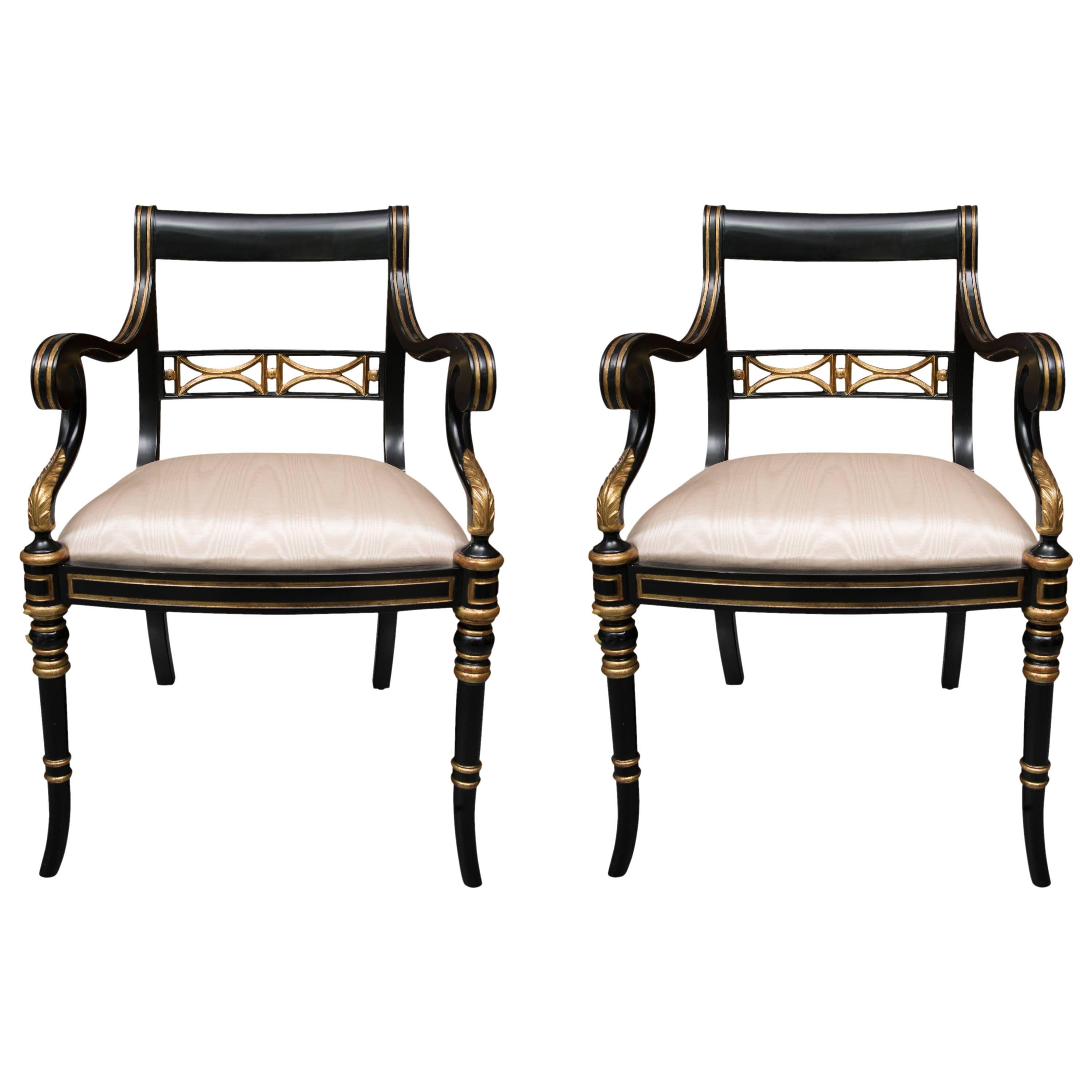 Pair of Regency Style Ebonized and Parcel Gilt Armchairs