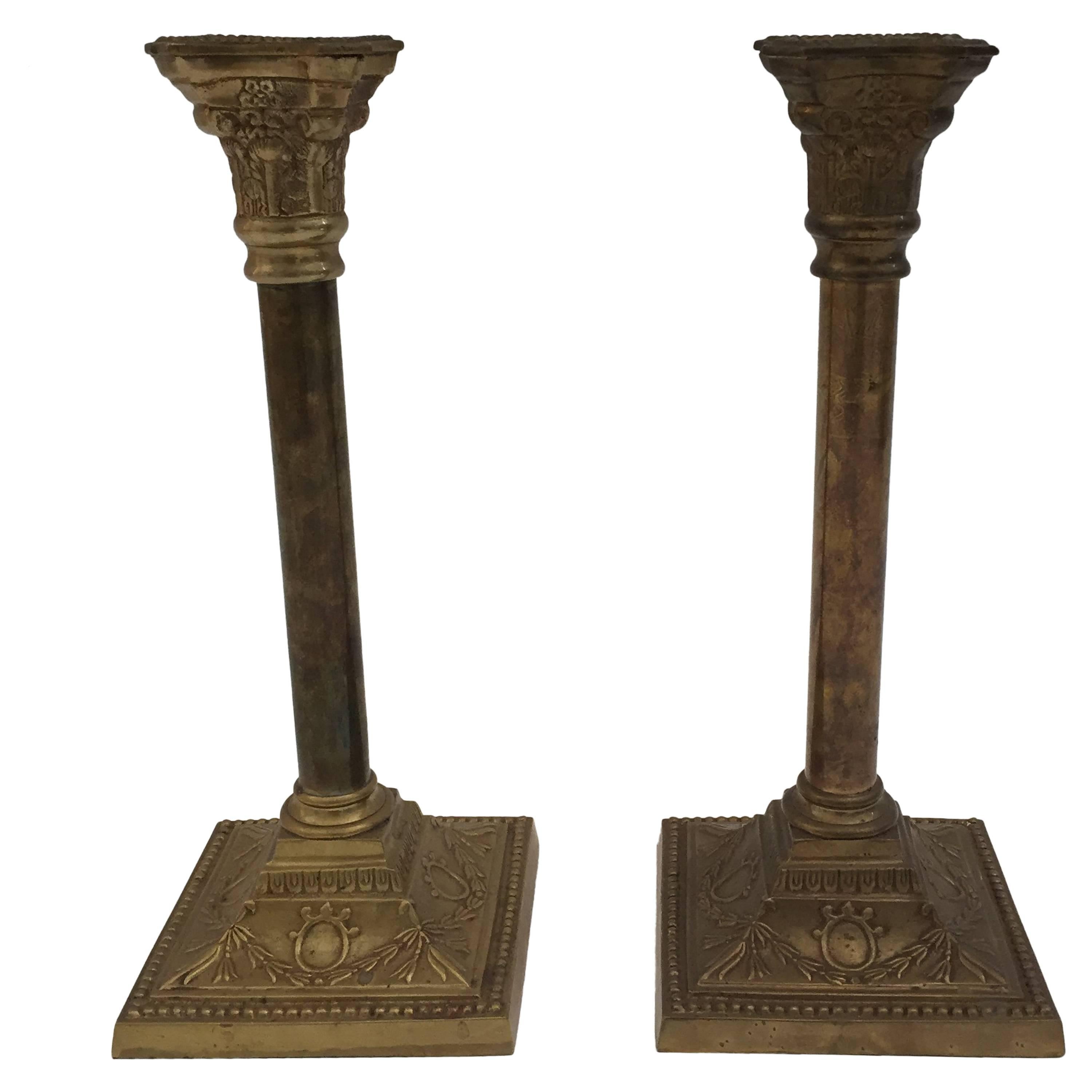 A very nice pair of George III Victorian neoclassical brass candlesticks with square bases and columnar shafts supporting urn form candle cups.
Early 20th Century English Georgian Brass Candlesticks - a Pair
Pair of Antique English Georgian Period