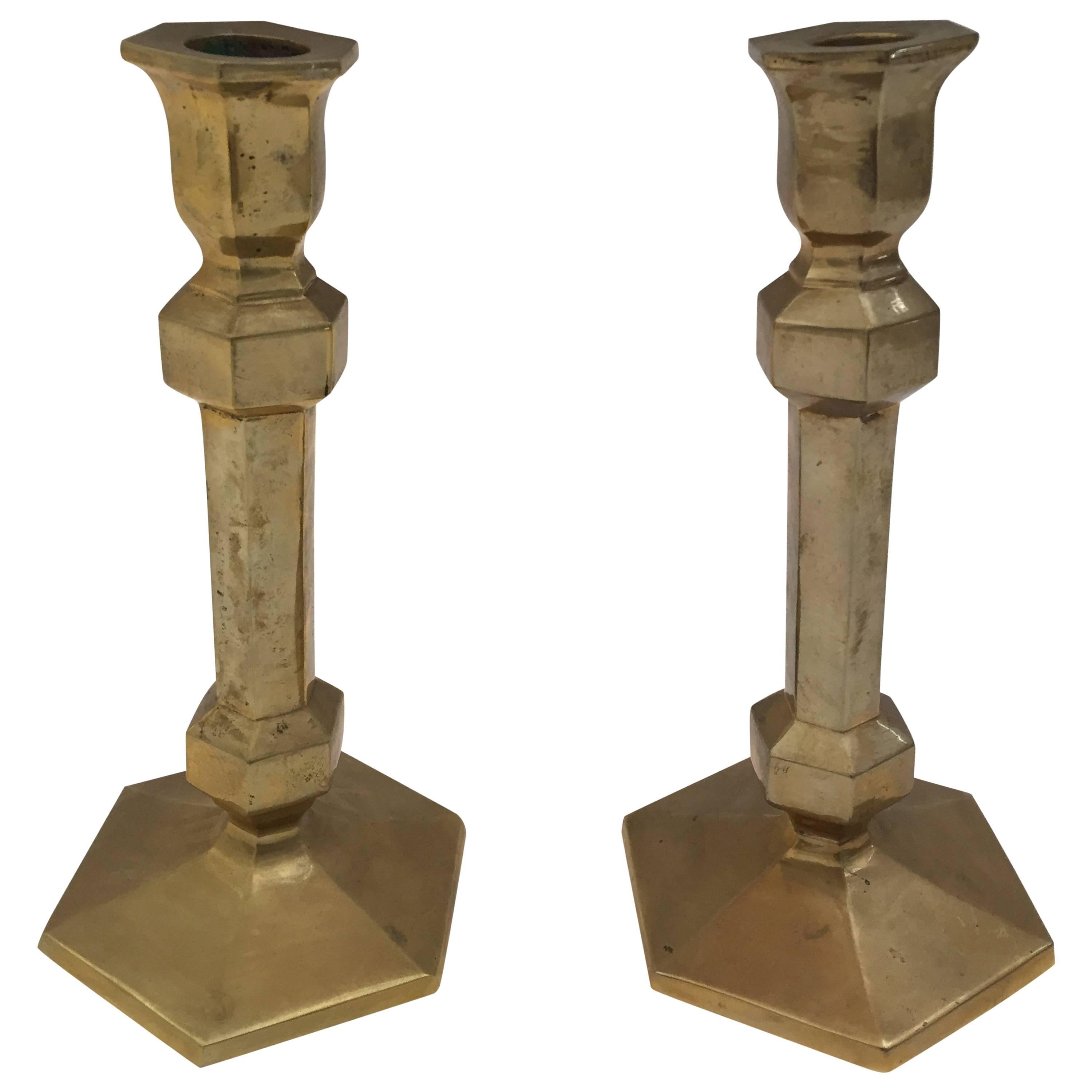 Pair of Victorian brass polished candlesticks with a molded hexagonal base.
Nice elegant forms with original patina.
Great brass decorative art objects.