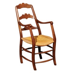 French Provincial Ladderback Armchair in Fruitwood with Rush Seat, ca. 1830