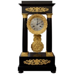 Antique Early 19th Century Ormolu and Ebonized Wood Empire Portico Clock