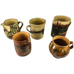 Collection of Five French Provincial Jaspe Pitchers, 19th Century