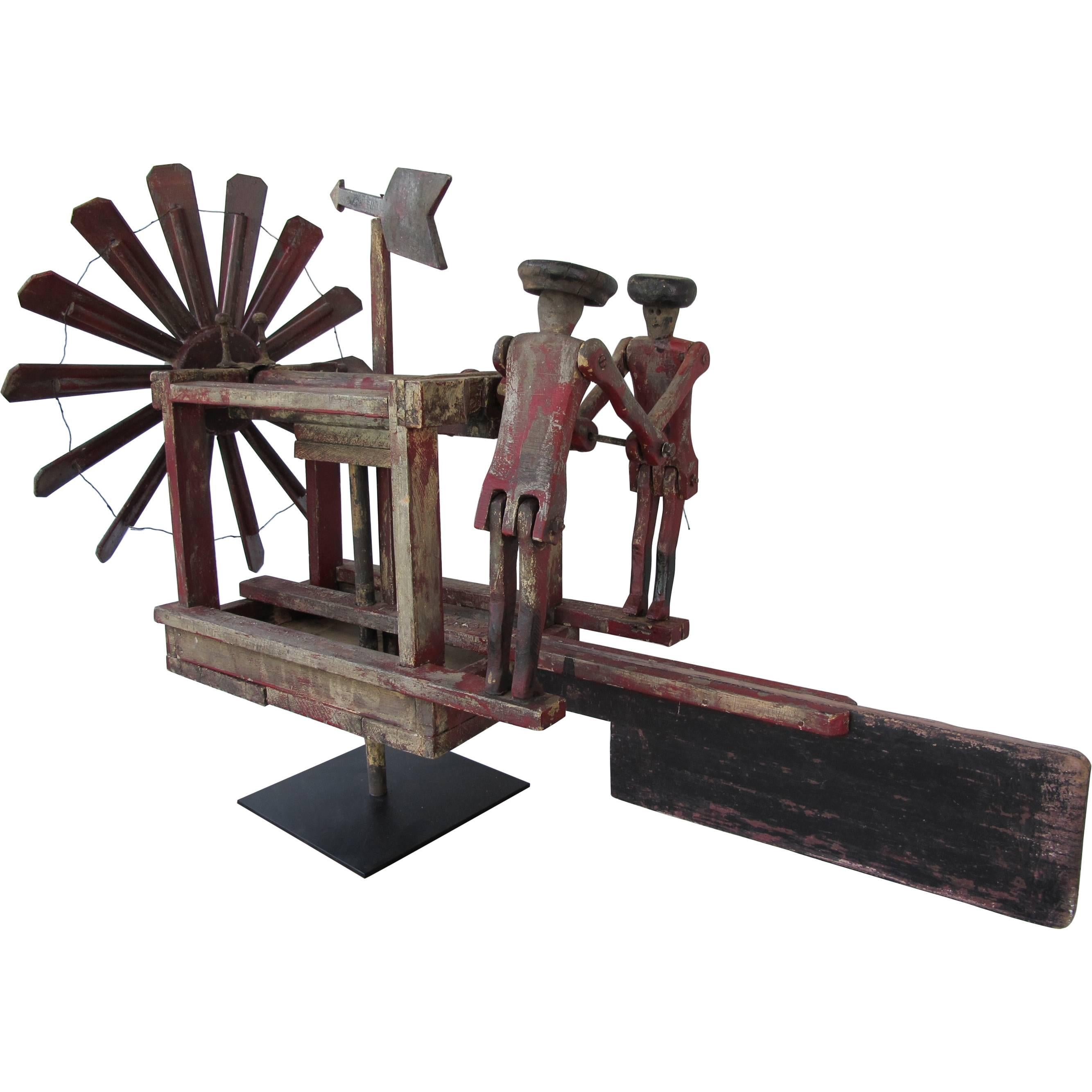 Whirligig with Propeller and Two Men in Hats Pumping For Sale